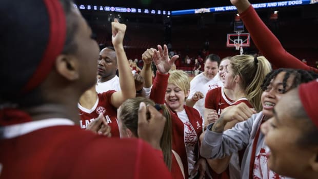 The team celebrates against Arkansas at Bud Walton Arena in Fayetteville , AR on Thursday, Jan 26, 2023.